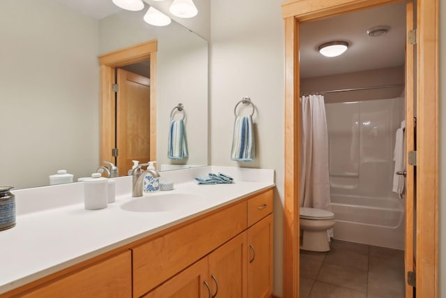 bathroom with tile patterned floors, shower / bath combo with shower curtain, toilet, and vanity