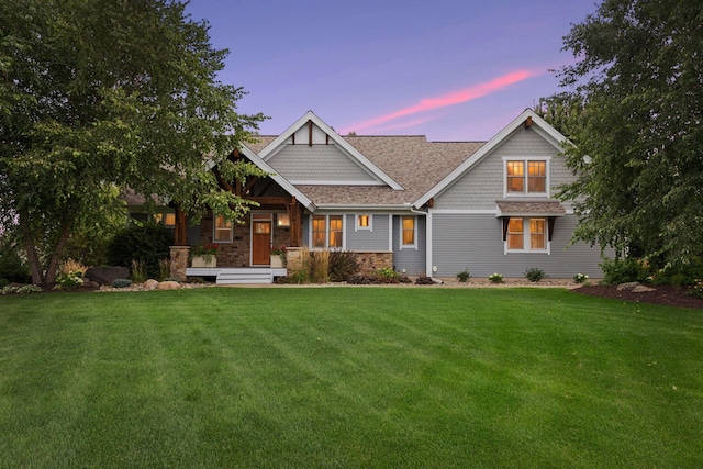 craftsman-style home with a lawn