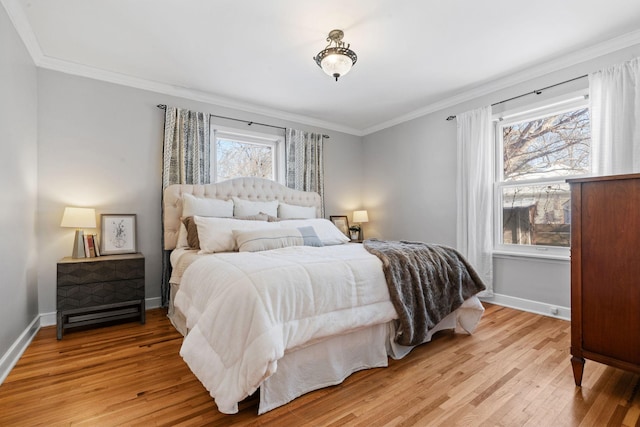 bedroom with light hardwood / wood-style floors and crown molding