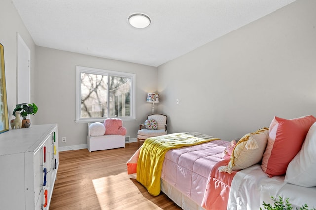 bedroom featuring light wood-type flooring