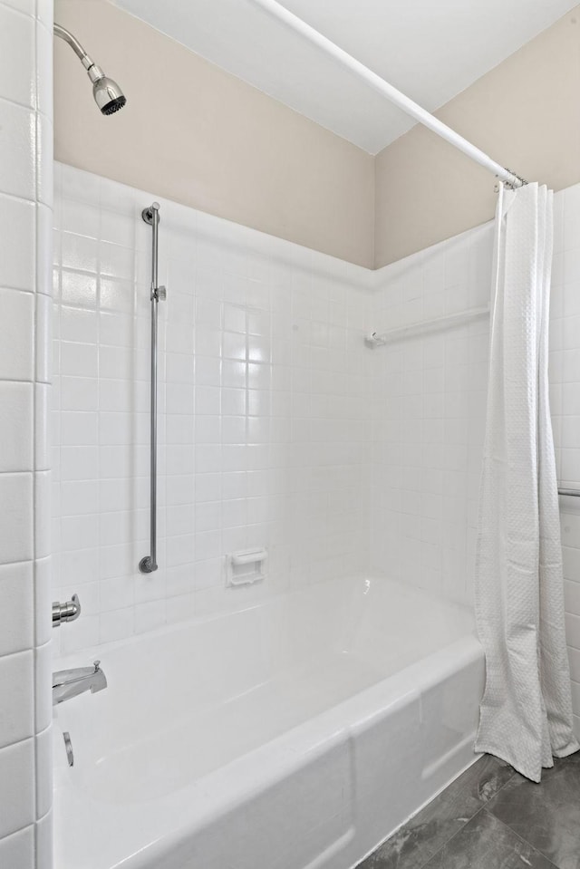 bathroom with shower / tub combo with curtain