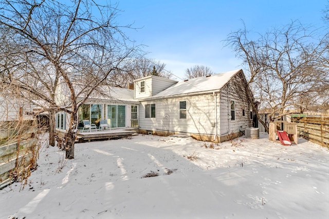 snow covered property featuring a wooden deck