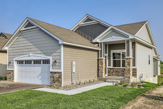 view of front of home with a garage, concrete driveway, stone siding, roof with shingles, and board and batten siding