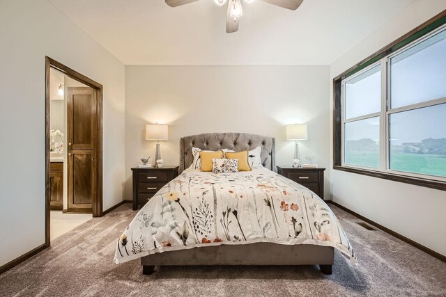 bedroom featuring ceiling fan and light carpet