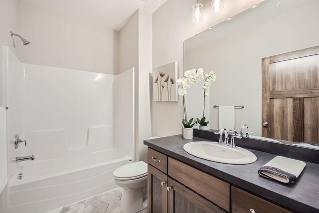 full bathroom featuring toilet, bathtub / shower combination, tile patterned flooring, and vanity