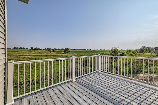 wooden terrace with a rural view