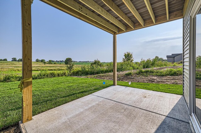 view of patio / terrace with a rural view