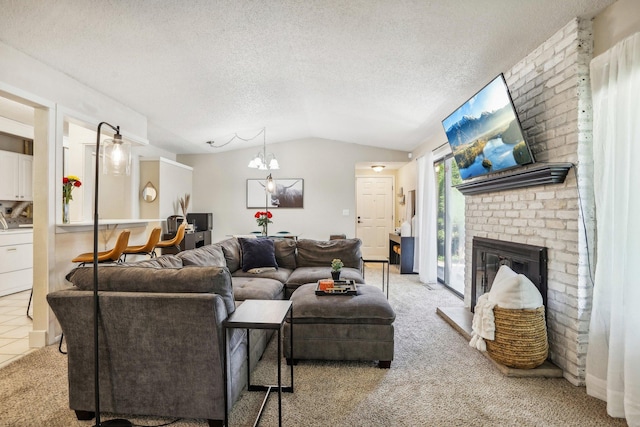 living room featuring a brick fireplace, a textured ceiling, a chandelier, light carpet, and vaulted ceiling