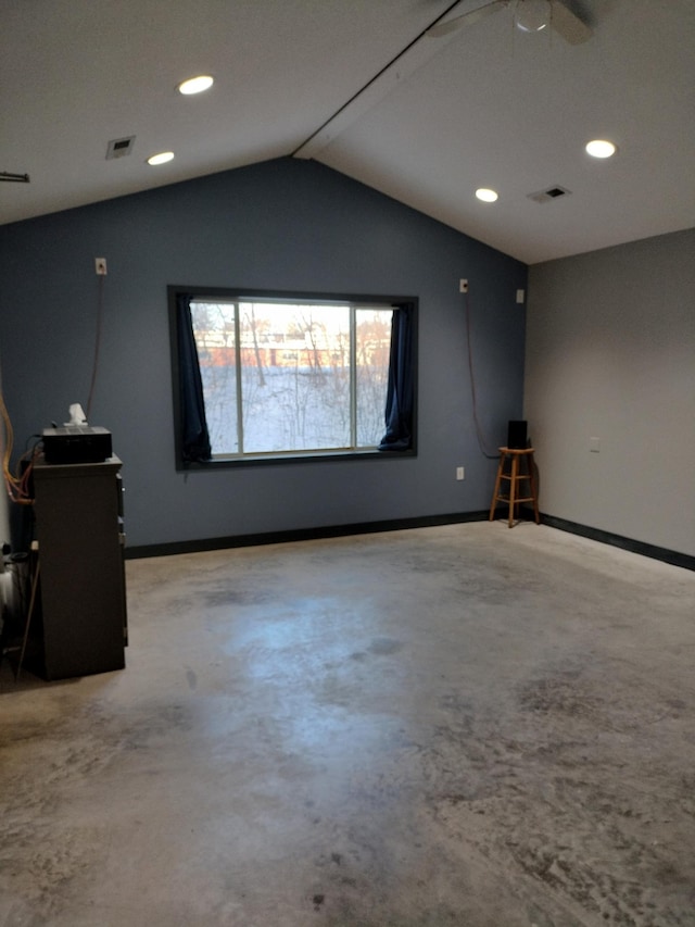 interior space featuring vaulted ceiling, concrete floors, and ceiling fan