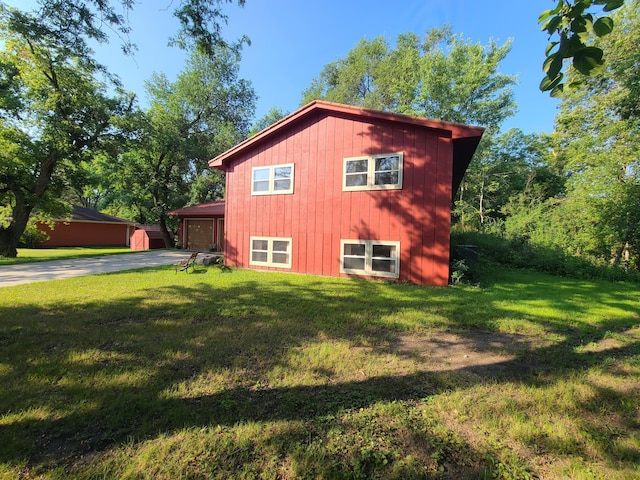 view of property exterior with a yard