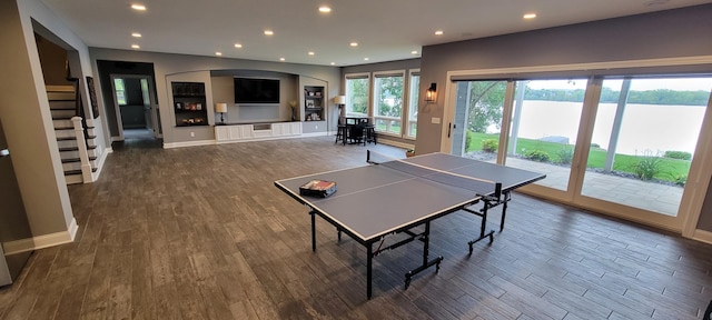 playroom with dark hardwood / wood-style floors