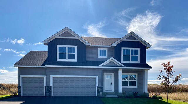 craftsman inspired home with a garage