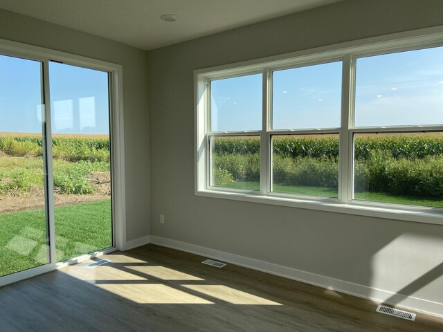 spare room with hardwood / wood-style flooring