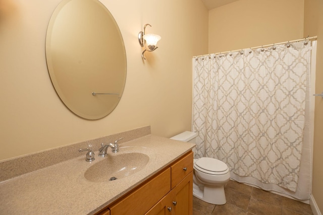 bathroom with walk in shower, vanity, and toilet