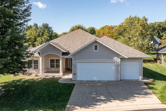 view of front facade with a garage and a front lawn