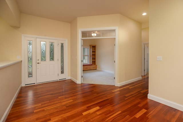 foyer entrance featuring dark wood-type flooring