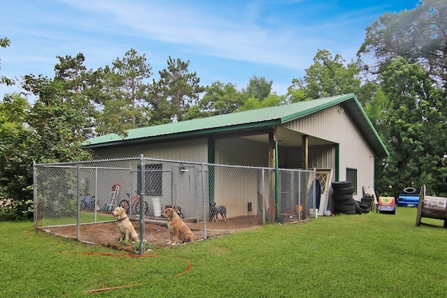 rear view of house with an outbuilding