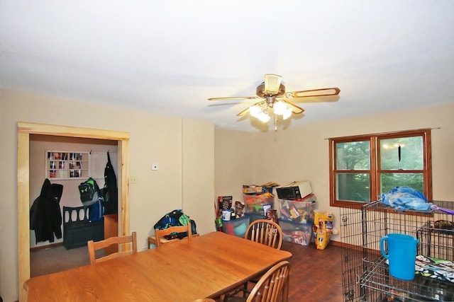 dining area featuring wood-type flooring and ceiling fan