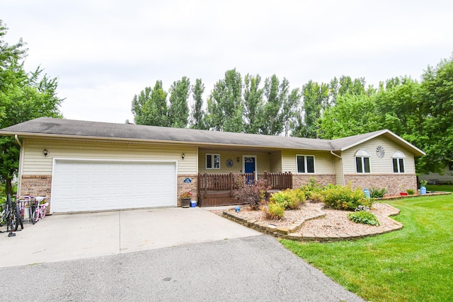 ranch-style house with a garage and a front lawn