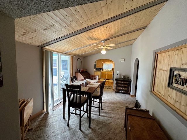 carpeted dining room with wood ceiling, ceiling fan, and lofted ceiling