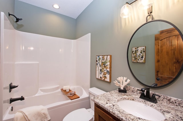 full bathroom featuring bathing tub / shower combination, vanity, and toilet