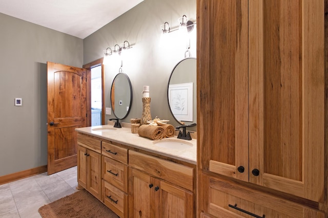 bathroom with tile patterned flooring and vanity