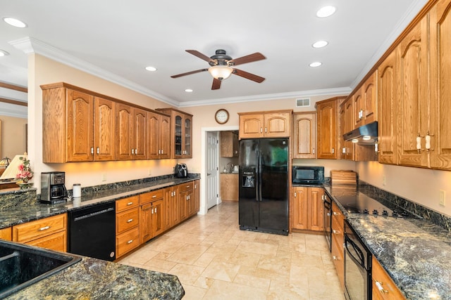 kitchen with brown cabinets, visible vents, under cabinet range hood, and black appliances