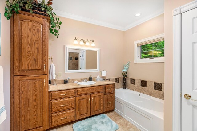 bathroom featuring tile patterned flooring, a garden tub, vanity, and crown molding