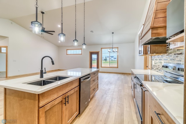 215 Emma Ct, Mapleton, ND 58059 - kitchen with stainless steel appliances, a sink, lofted ceiling, backsplash, and light countertops