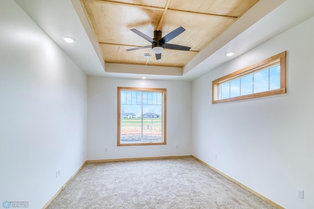 215 Emma Ct, Mapleton, ND 58059 - empty room with a raised ceiling, carpet flooring, ceiling fan, baseboards, and recessed lighting