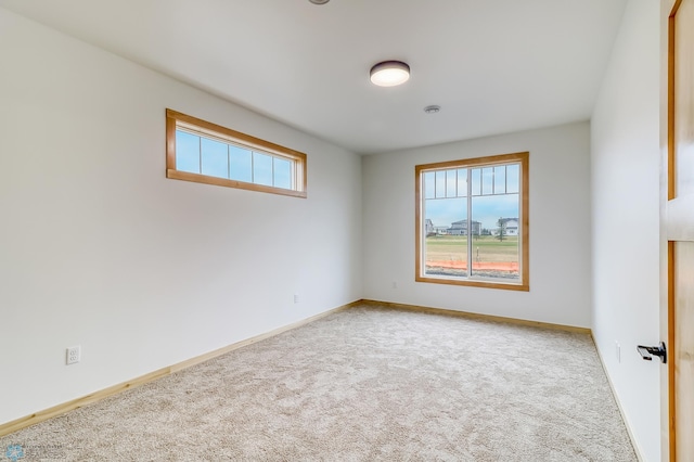 unfurnished room featuring carpet flooring