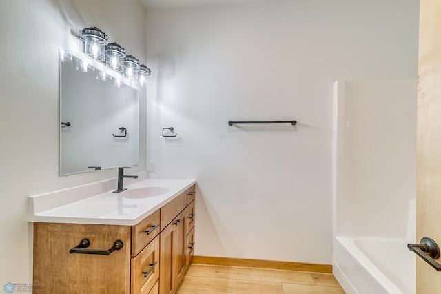 bathroom featuring hardwood / wood-style floors and vanity