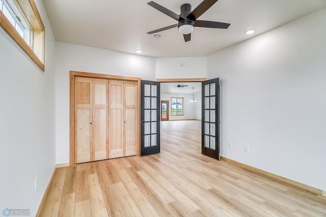 215 Emma Ct, Mapleton, ND 58059 - unfurnished bedroom featuring light wood finished floors, french doors, recessed lighting, and baseboards
