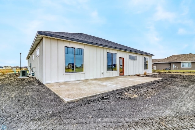 rear view of house featuring a patio area and cooling unit