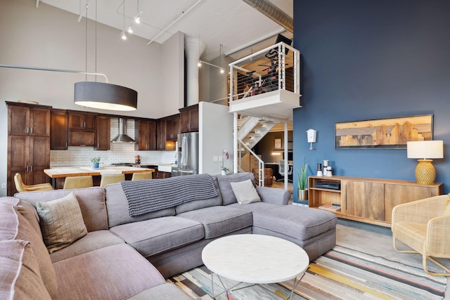 living room with a towering ceiling