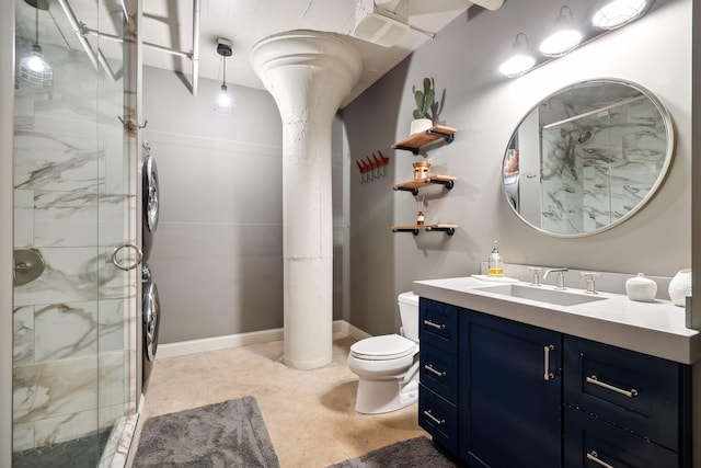 bathroom featuring vanity, toilet, and a shower with door