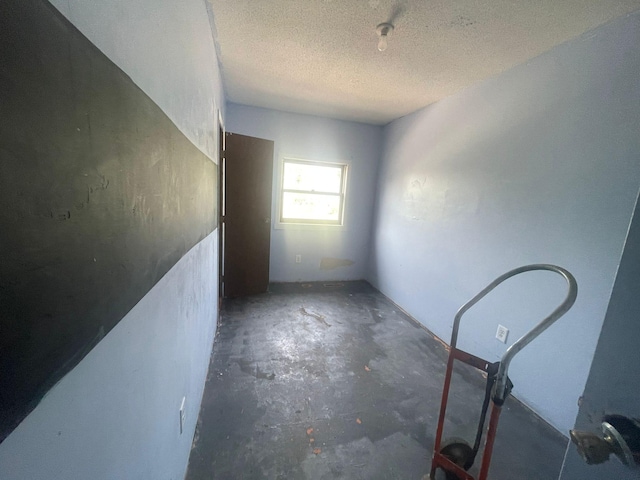 empty room with a textured ceiling