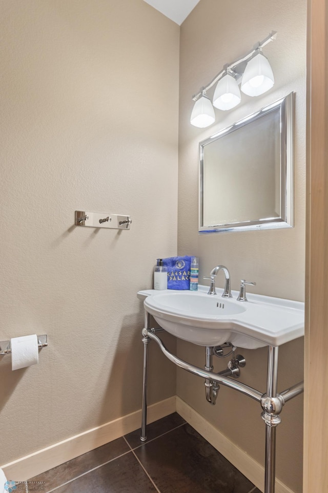 bathroom with tile patterned floors