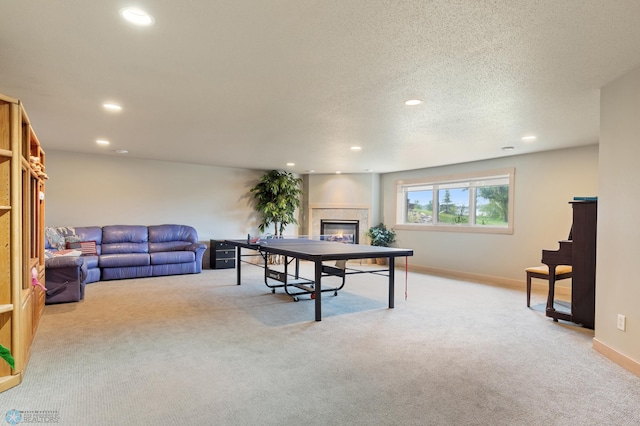 office area featuring light carpet and a textured ceiling