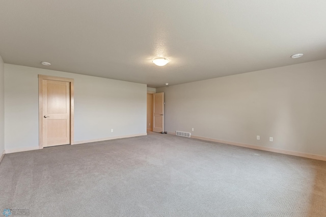 unfurnished room featuring carpet