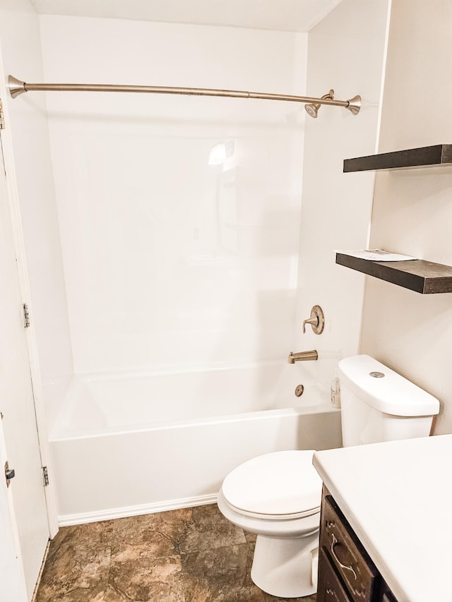 full bathroom featuring washtub / shower combination, vanity, and toilet