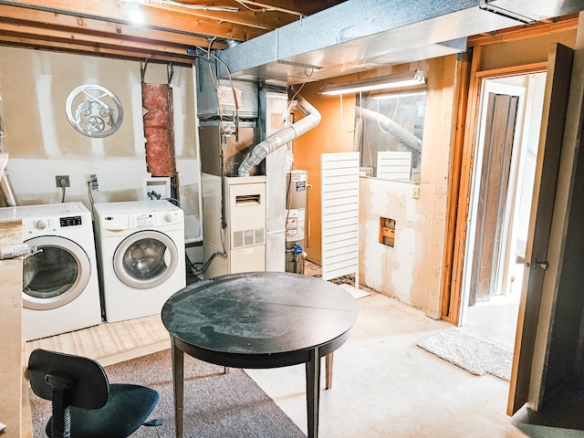 laundry room featuring washing machine and dryer and gas water heater