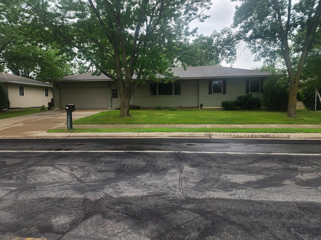 single story home featuring a front yard and a garage