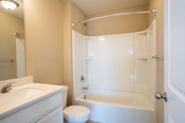 full bathroom with washtub / shower combination, vanity, a textured ceiling, and toilet