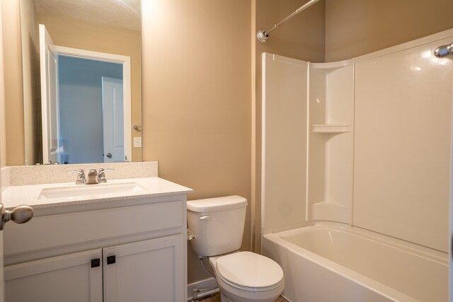 full bathroom with vanity, toilet, and washtub / shower combination