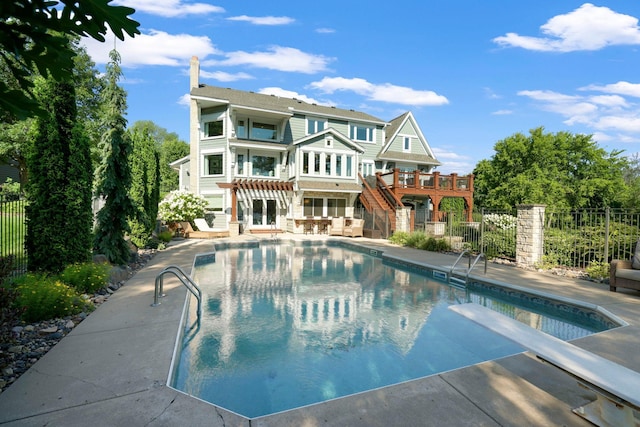 15707 Island View Rd NW, Prior Lake, MN 55372 - rear view of property with a patio, stairway, fence, and a fenced in pool