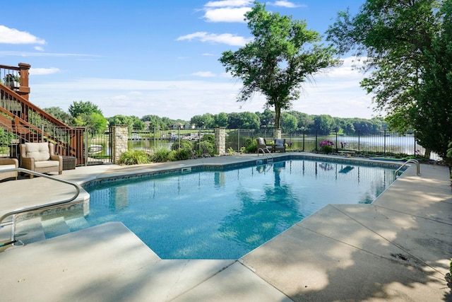 15707 Island View Rd NW, Prior Lake, MN 55372 - view of swimming pool featuring fence, stairs, a patio area, and a fenced in pool
