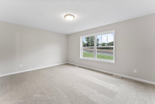 unfurnished room with carpet flooring