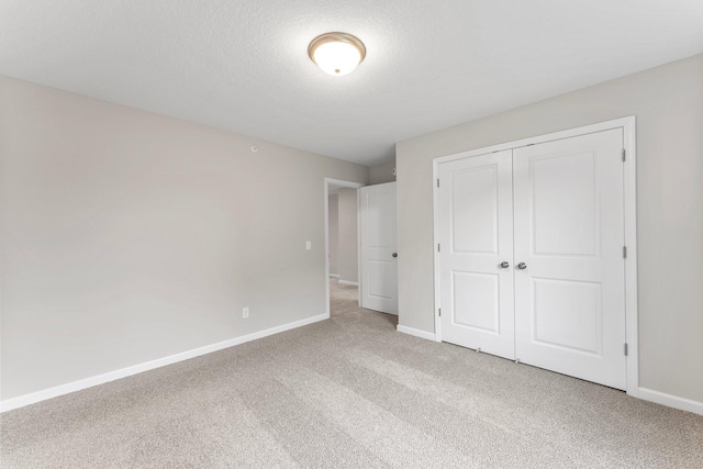 unfurnished bedroom featuring a closet and carpet