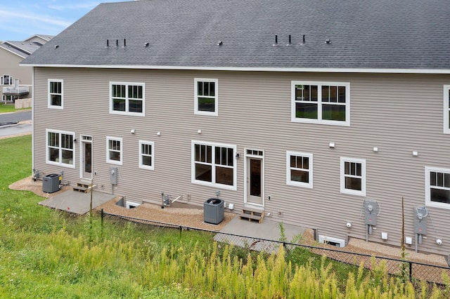 back of house featuring cooling unit and a patio area